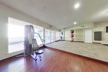 This is a photo of the 24-Hour Fitness Center at Princeton Court and Harvard Square Apartments in the Vickery Midtown neighborhood of Dallas, TX.